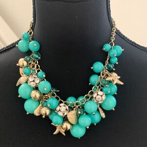 NWT Dillards Elegant Gold Tone and Turquoise Beaded Beach / Starfish Necklace.
